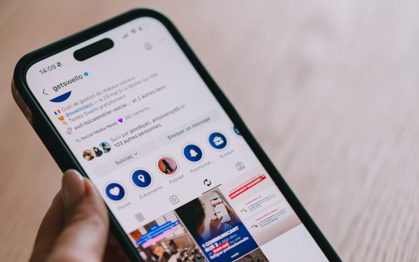 Phone displaying a social media feed