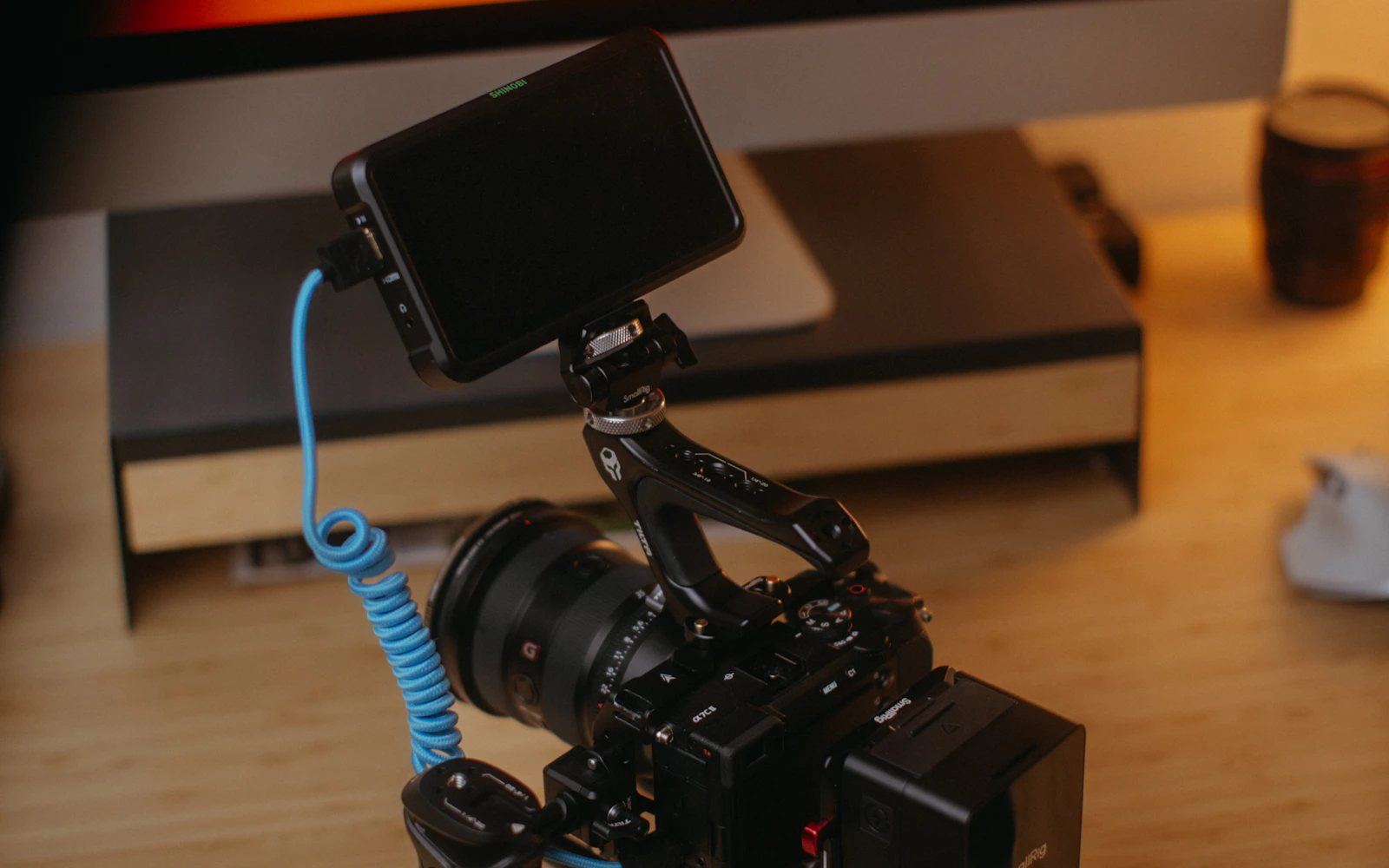 Professional camera on a wooden desk